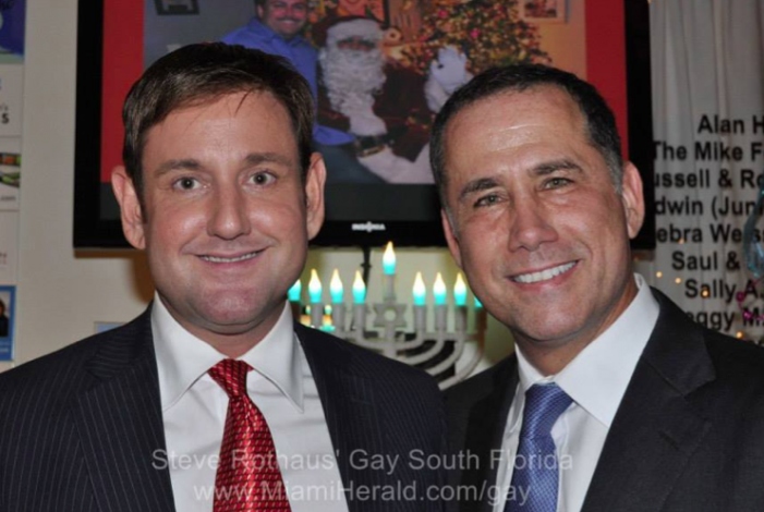 Philip Levine, Michael Gongora smile for the holiday camera