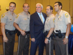 Carlos Gimenez poses with officers after winning the 2011 post-recall election