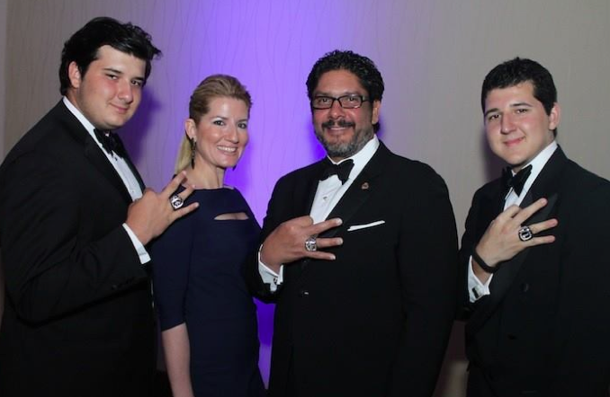 Lobbyist Jorge Luis Lopez and sons wear championship rings