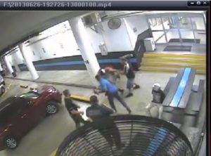 The video at the parking garage in the police station clearly shows the officer punching the lady with a hard right hook.