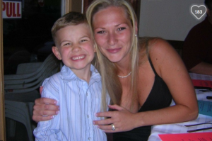 Sarah Stanczyk poses in better times with the son of one of her best friends.