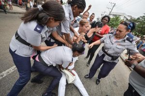 Adalberto Roque/AFP captures the moment a Lady in White peaceful protester is hauled off to jail on Dec. 10. Ten days ago.