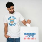 a man dropping his vote in white box